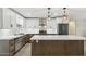 Modern kitchen featuring white cabinets, stainless steel appliances, and a center island at 2202 E Osborn Rd, Phoenix, AZ 85016