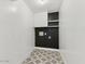 Functional laundry room with storage cabinets and stylish patterned tile flooring at 2202 E Osborn Rd, Phoenix, AZ 85016