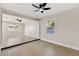 Spacious living room showcases light wood floors, a ceiling fan, and plenty of natural light at 2202 E Osborn Rd, Phoenix, AZ 85016