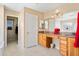 Bright bathroom with double sinks, vanity, granite counters and tiled floors at 25776 N Sandstone Way, Surprise, AZ 85387