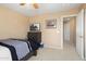 Comfortable bedroom with neutral walls, ceiling fan, carpeted floors, and a TV on dresser at 25776 N Sandstone Way, Surprise, AZ 85387