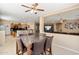 Open-concept dining area adjacent to the kitchen, perfect for entertaining, with six chairs at 25776 N Sandstone Way, Surprise, AZ 85387