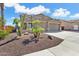 Charming two-story home with a three-car garage and desert landscaping at 25776 N Sandstone Way, Surprise, AZ 85387