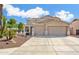 Charming two-story home with a three-car garage and desert landscaping at 25776 N Sandstone Way, Surprise, AZ 85387