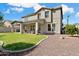 A two story home, featuring green grass and a covered patio at 25776 N Sandstone Way, Surprise, AZ 85387
