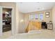 Upstairs hallway including a storage closet, study nook, and staircase to the lower level at 25776 N Sandstone Way, Surprise, AZ 85387