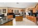 Modern kitchen with stainless steel appliances, granite countertops, and a functional island at 25776 N Sandstone Way, Surprise, AZ 85387