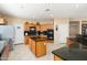Spacious kitchen featuring a kitchen island, stainless steel appliances, and ample counter space at 25776 N Sandstone Way, Surprise, AZ 85387