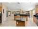 Stylish kitchen island, stainless steel appliances, and open floor plan, perfect for gatherings at 25776 N Sandstone Way, Surprise, AZ 85387