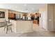Well-equipped kitchen with granite countertops, breakfast bar, and ample cabinet space at 25776 N Sandstone Way, Surprise, AZ 85387