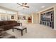 Open-concept living room leading to a kitchen and another living space at 25776 N Sandstone Way, Surprise, AZ 85387