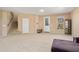 Open living room area with access to a staircase and the front door at 25776 N Sandstone Way, Surprise, AZ 85387