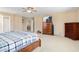 Spacious main bedroom with a ceiling fan, walk-in closet, and an adjoining ensuite bathroom at 25776 N Sandstone Way, Surprise, AZ 85387