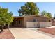 Single-story home with a covered carport and low-maintenance landscaping, creating a welcoming curb appeal at 26235 S Lakeview Dr, Sun Lakes, AZ 85248