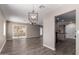 Spacious living room with an open floor plan, modern lighting, and sliding glass doors leading to the outdoors at 26235 S Lakeview Dr, Sun Lakes, AZ 85248