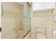 Bathroom featuring a shower with glass door, toilet and storage cabinet at 3031 N Civic Center Plz # 306, Scottsdale, AZ 85251