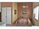 Cozy bedroom with warm color scheme, ceiling fan, natural light, and closet space at 3031 N Civic Center Plz # 306, Scottsdale, AZ 85251