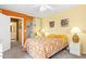 Bedroom with ensuite bathroom, closet, and tropical-themed decor at 3031 N Civic Center Plz # 306, Scottsdale, AZ 85251