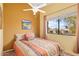 Comfortable bedroom with ceiling fan, large window, and neutral decor at 3031 N Civic Center Plz # 306, Scottsdale, AZ 85251