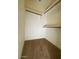 Walk-in closet with a rod to hang clothes and shelf storage at 3031 N Civic Center Plz # 306, Scottsdale, AZ 85251