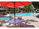 Resort-style community pool with a hot tub, ample seating, and shaded areas at 3031 N Civic Center Plz # 306, Scottsdale, AZ 85251