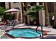 Inviting community hot tub surrounded by lush landscaping and seating area at 3031 N Civic Center Plz # 306, Scottsdale, AZ 85251