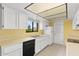 Efficient kitchen with white appliances, storage, and a window offering natural light at 3031 N Civic Center Plz # 306, Scottsdale, AZ 85251