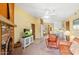 Bright living room with fireplace, offering a glimpse into the bedroom and kitchen areas at 3031 N Civic Center Plz # 306, Scottsdale, AZ 85251