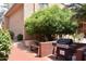 Outdoor grill with barbecue, bench, and mature tree providing a perfect setup for outdoor cooking and relaxation at 3031 N Civic Center Plz # 306, Scottsdale, AZ 85251