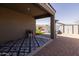 Covered patio with tiled flooring, overlooking a backyard with a play area at 37236 N Navarra Rd, San Tan Valley, AZ 85140