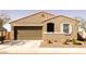 Charming single-story home featuring a two-car garage and well-maintained landscaping at 37236 N Navarra Rd, San Tan Valley, AZ 85140