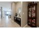 Inviting hallway with stylish decor, a mirror, and a cabinet, leading to the living areas at 37236 N Navarra Rd, San Tan Valley, AZ 85140