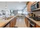 Modern kitchen featuring a large island, stainless steel appliances, and an open layout design at 37236 N Navarra Rd, San Tan Valley, AZ 85140