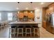 Well-designed kitchen with a large island, granite counters, and stainless-steel appliances at 37236 N Navarra Rd, San Tan Valley, AZ 85140