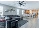 Open-concept living area featuring a comfortable seating area, a dining space, and a modern kitchen at 37236 N Navarra Rd, San Tan Valley, AZ 85140