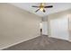 Bedroom featuring neutral walls, carpet, closet and a ceiling fan at 3802 E Stiles Ln, Gilbert, AZ 85295