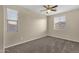 A bedroom featuring multiple windows providing ample natural light and carpet at 3802 E Stiles Ln, Gilbert, AZ 85295