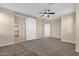 Large bedroom with sliding barn door, standard door and carpet at 3802 E Stiles Ln, Gilbert, AZ 85295