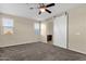 Large bedroom with windows, sliding barn door and carpet at 3802 E Stiles Ln, Gilbert, AZ 85295