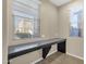 Sunlit bedroom with windows, built-in desk and tile floor at 3802 E Stiles Ln, Gilbert, AZ 85295
