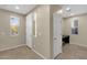 Inviting entryway with neutral walls, tile flooring, and ample natural light from large windows at 3802 E Stiles Ln, Gilbert, AZ 85295