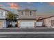 A well-kept two-story home featuring a clean white garage door, complemented by manicured landscaping at 3802 E Stiles Ln, Gilbert, AZ 85295