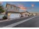 A modern two-story home featuring an attached garage, complemented by clean landscaping at 3802 E Stiles Ln, Gilbert, AZ 85295