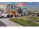 Charming two-story home with neutral siding, manicured lawn, sidewalk, and inviting front yard at 3802 E Stiles Ln, Gilbert, AZ 85295