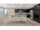 Kitchen featuring granite island, stainless appliances, and dark cabinets at 3802 E Stiles Ln, Gilbert, AZ 85295