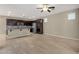 Open kitchen with dark wood cabinetry, granite counters and stainless appliances at 3802 E Stiles Ln, Gilbert, AZ 85295