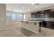 Modern kitchen featuring granite breakfast bar and a pendant light at 3802 E Stiles Ln, Gilbert, AZ 85295