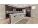 Kitchen with granite island, stainless appliances, and dark wood cabinetry at 3802 E Stiles Ln, Gilbert, AZ 85295