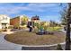 A charming neighborhood playground features a slide and climbing structure for Gathering fun at 3802 E Stiles Ln, Gilbert, AZ 85295