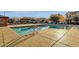 Community pool with lounge chairs and a pergola, perfect for relaxation and recreation at 3802 E Stiles Ln, Gilbert, AZ 85295